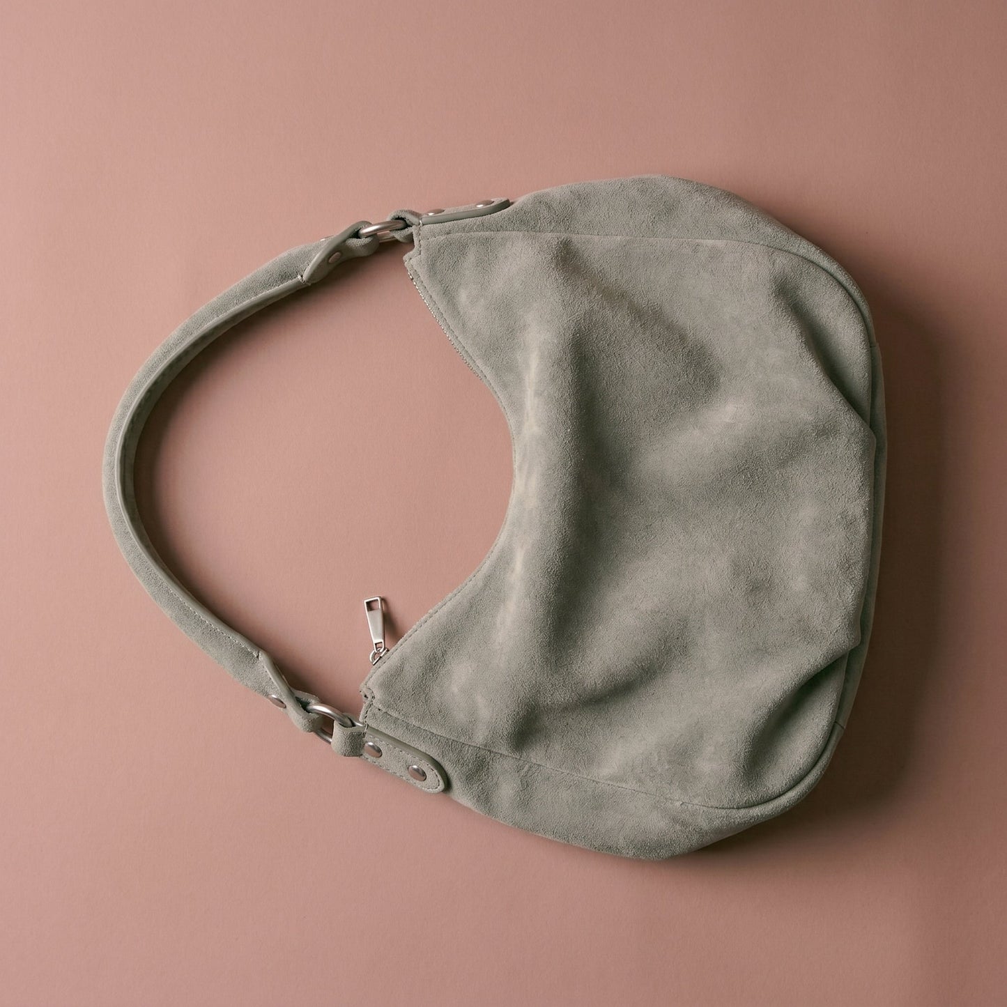Gray handbag on a brown background