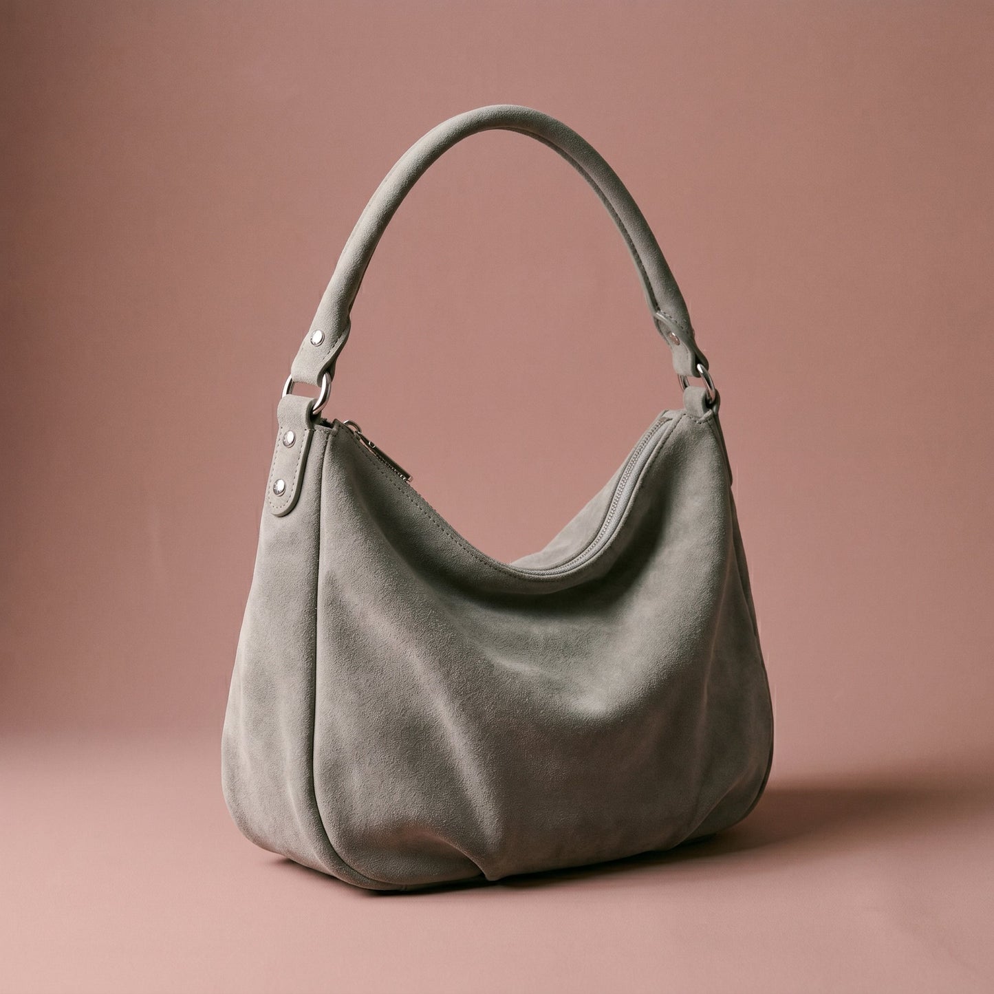 Gray handbag on a brown background