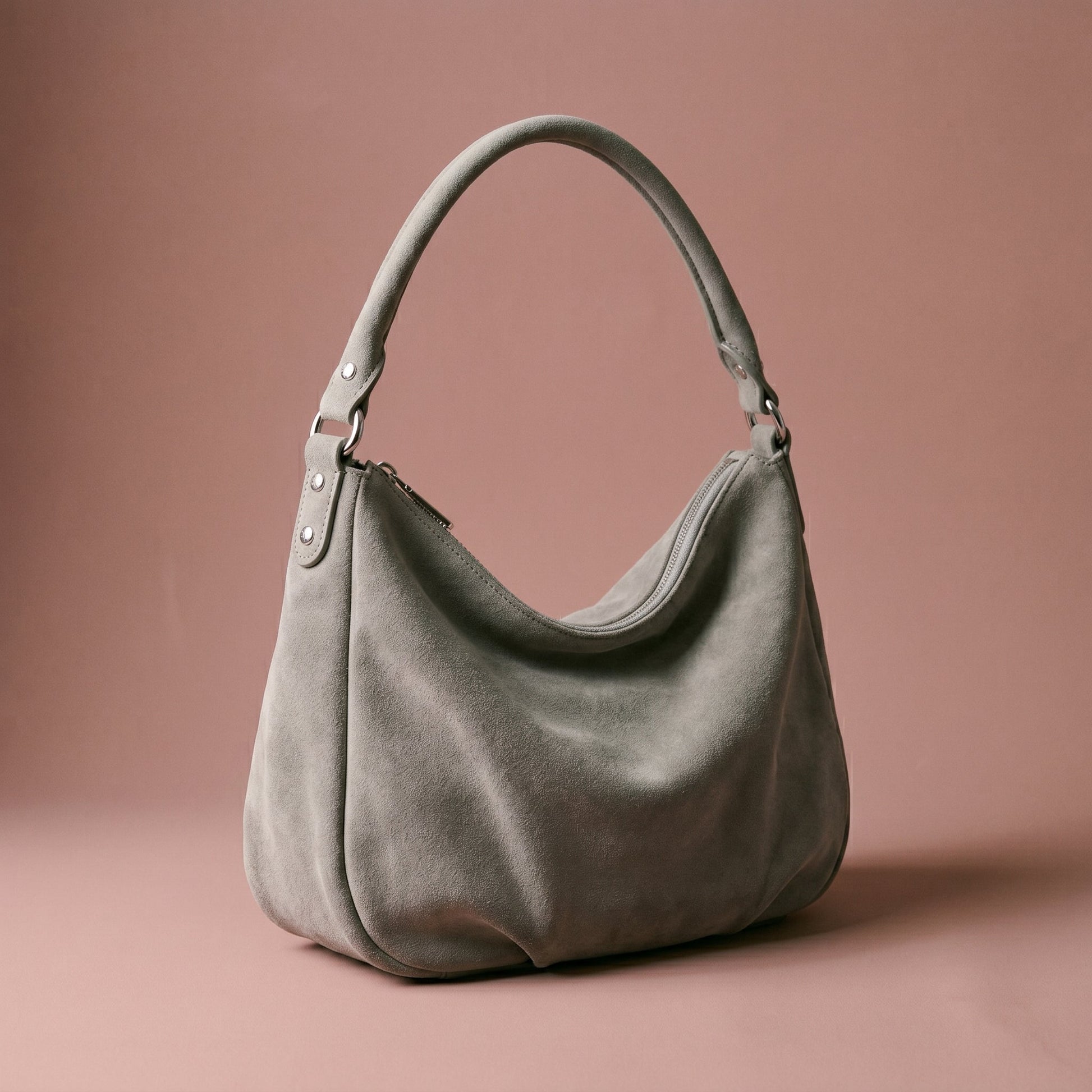 Gray handbag on a brown background